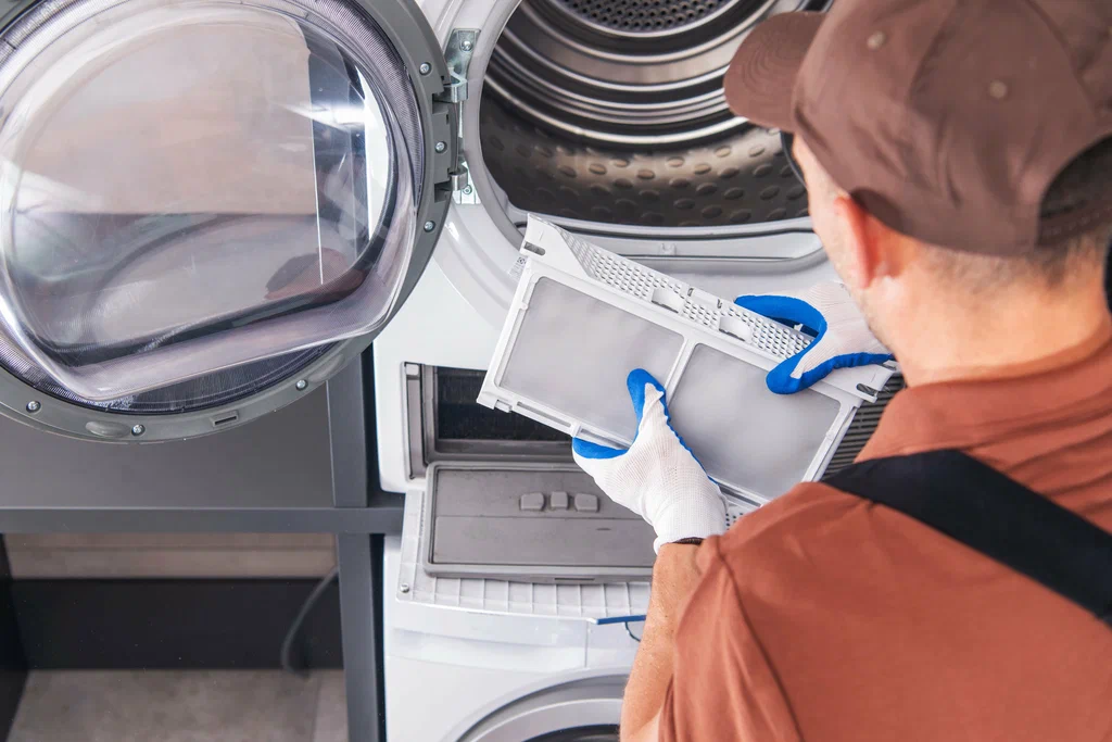 Technician repairing a Samsung dryer during a same-day service call in Brandon